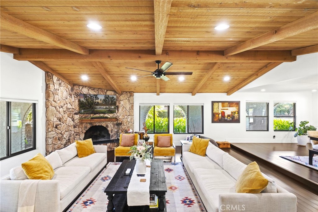 7710 Broadacre Place Riverside, CA 92504 - Photo 7 of 65 a living room with furniture or chandelier and a fireplace