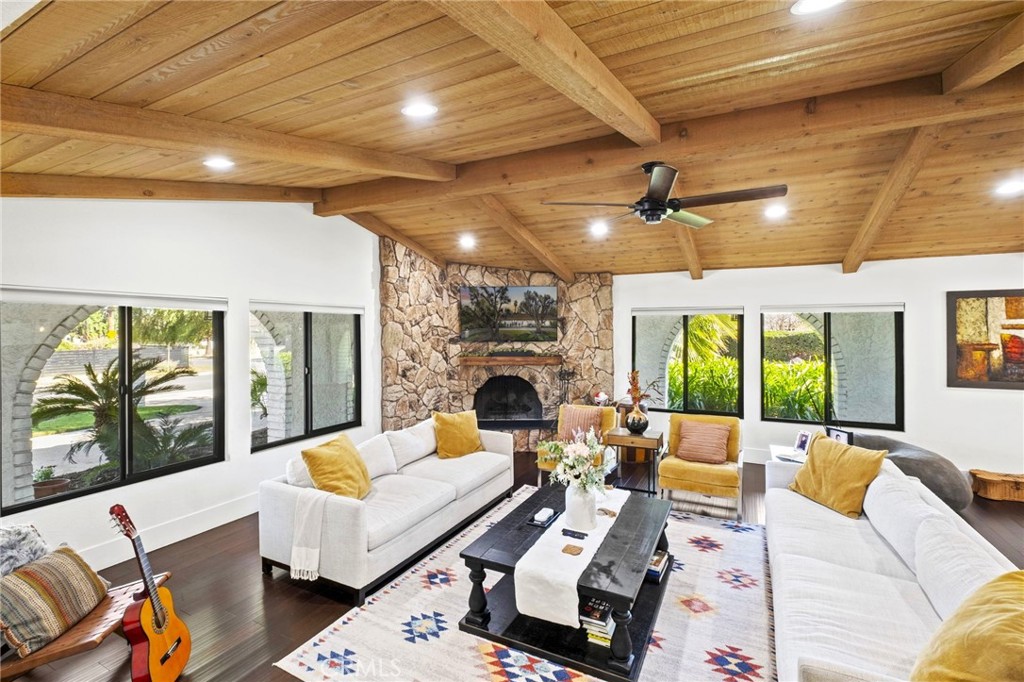 7710 Broadacre Place Riverside, CA 92504 - Photo 8 of 65 a living room with furniture fireplace and large windows
