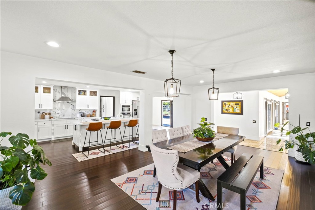 7710 Broadacre Place Riverside, CA 92504 - Photo 10 of 65 a view of a dining room with furniture window and wooden floor