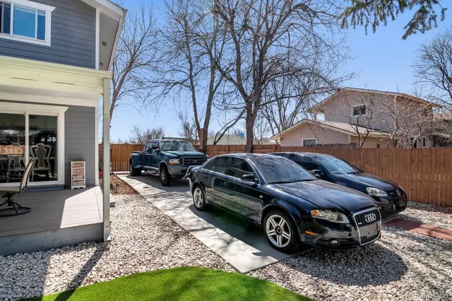a car parked in front of a brick house