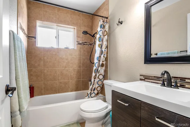 a bathroom with a sink a toilet and a bathtub