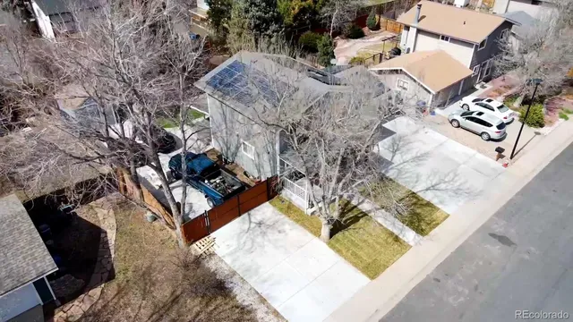 an aerial view of a house with a yard