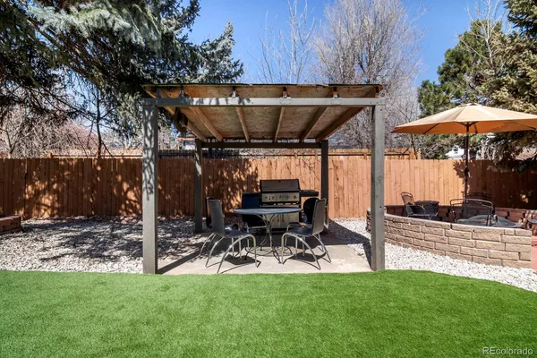 a view of yard with patio