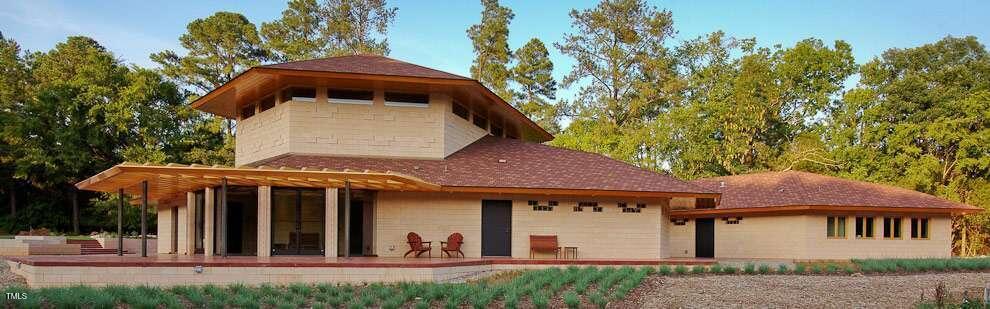2540 Seaforth Road Pittsboro, NC 27312 - Photo 4 of 14 a front view of a house with garden