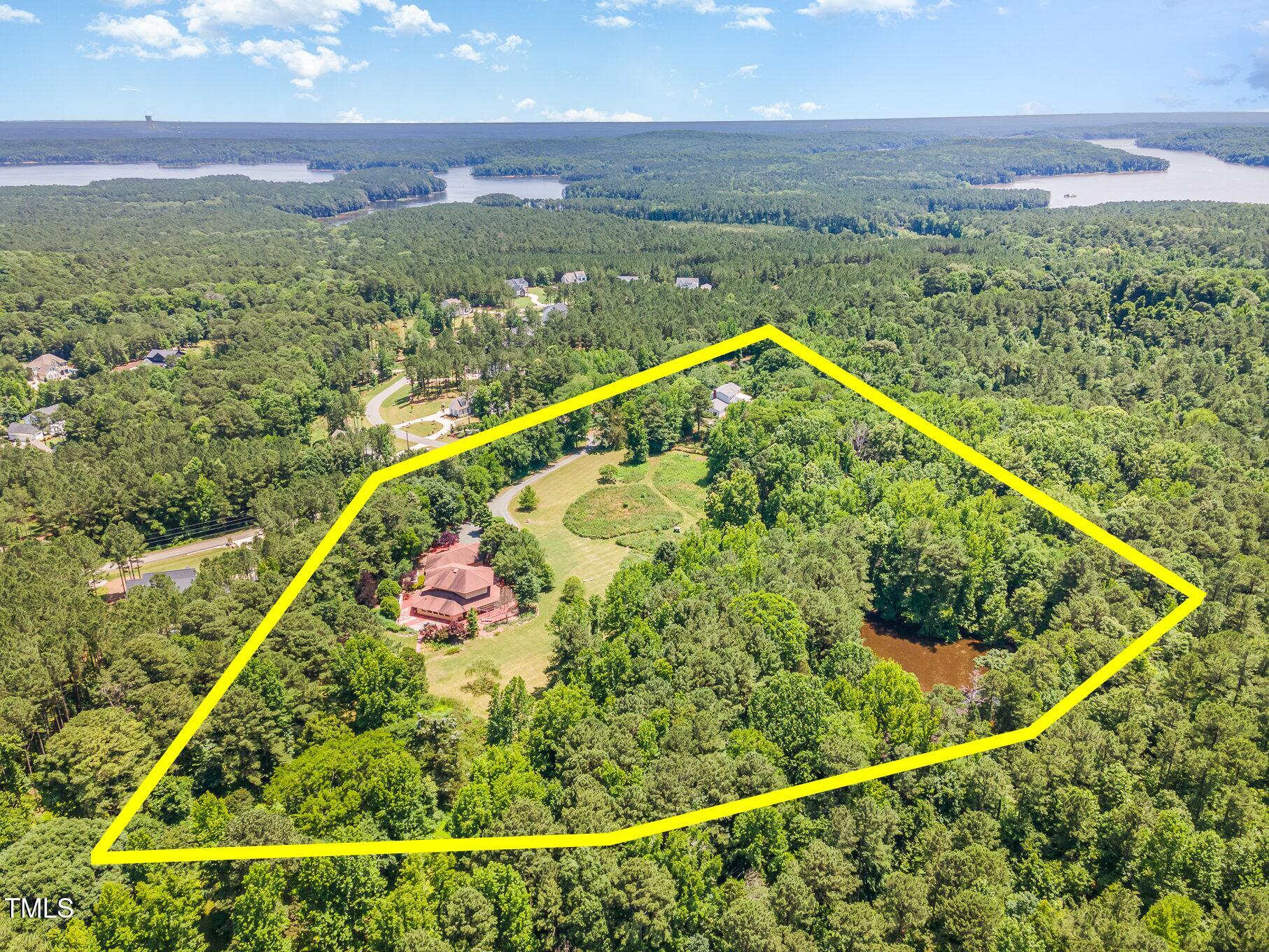 2540 Seaforth Road Pittsboro, NC 27312 - Photo 5 of 14 a view of a balcony with an outdoor space and seating area