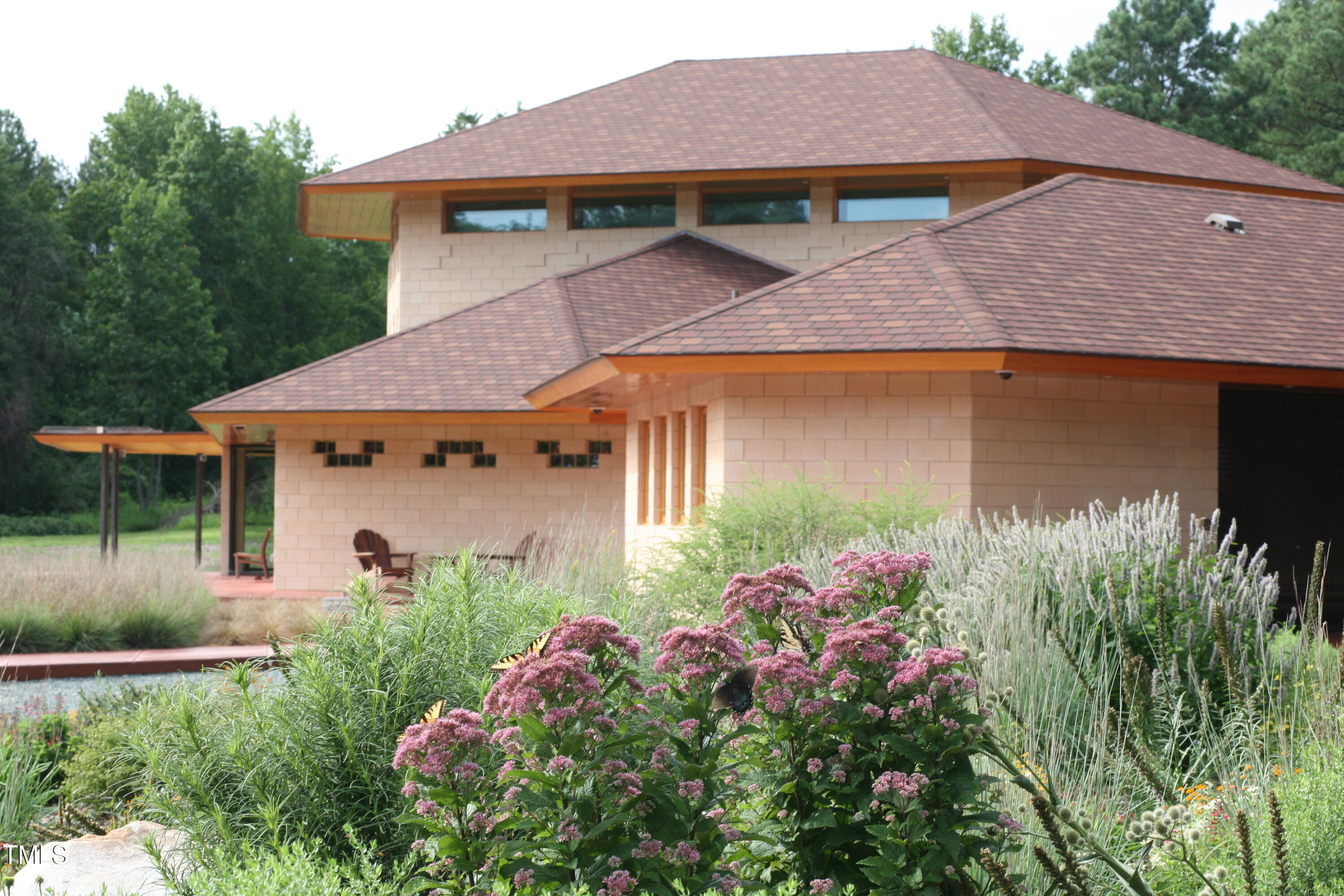 2540 Seaforth Road Pittsboro, NC 27312 - Photo 6 of 14 a front view of a house with garden