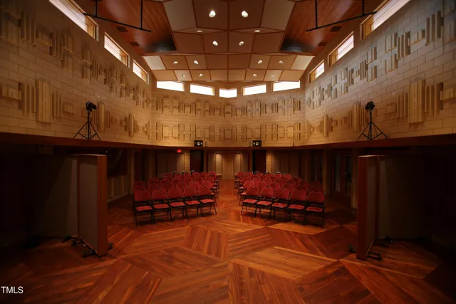 a view of a swimming pool with an outdoor seating