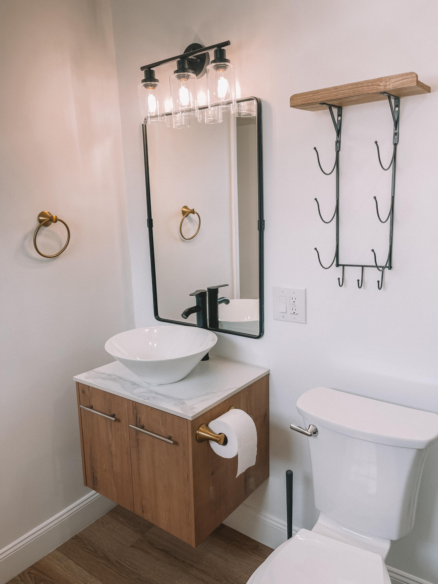 2171 Northeast 44th Court Lighthouse Point, FL 33064 - Photo 21 of 24 a bathroom with a granite countertop toilet sink and mirror
