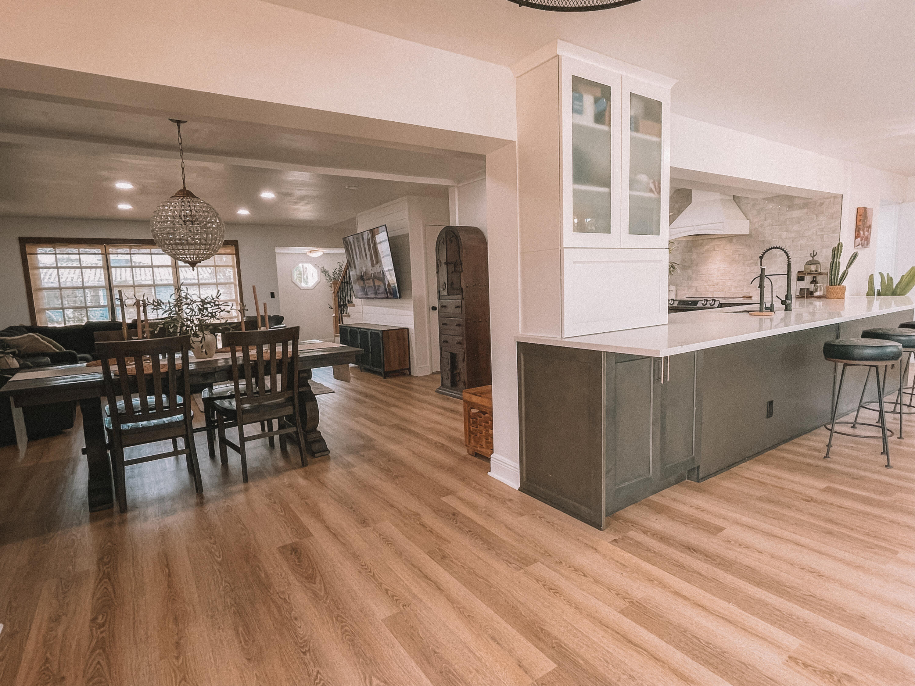 2171 Northeast 44th Court Lighthouse Point, FL 33064 - Photo 23 of 24 a kitchen with stainless steel appliances granite countertop a table chairs and a wooden floor