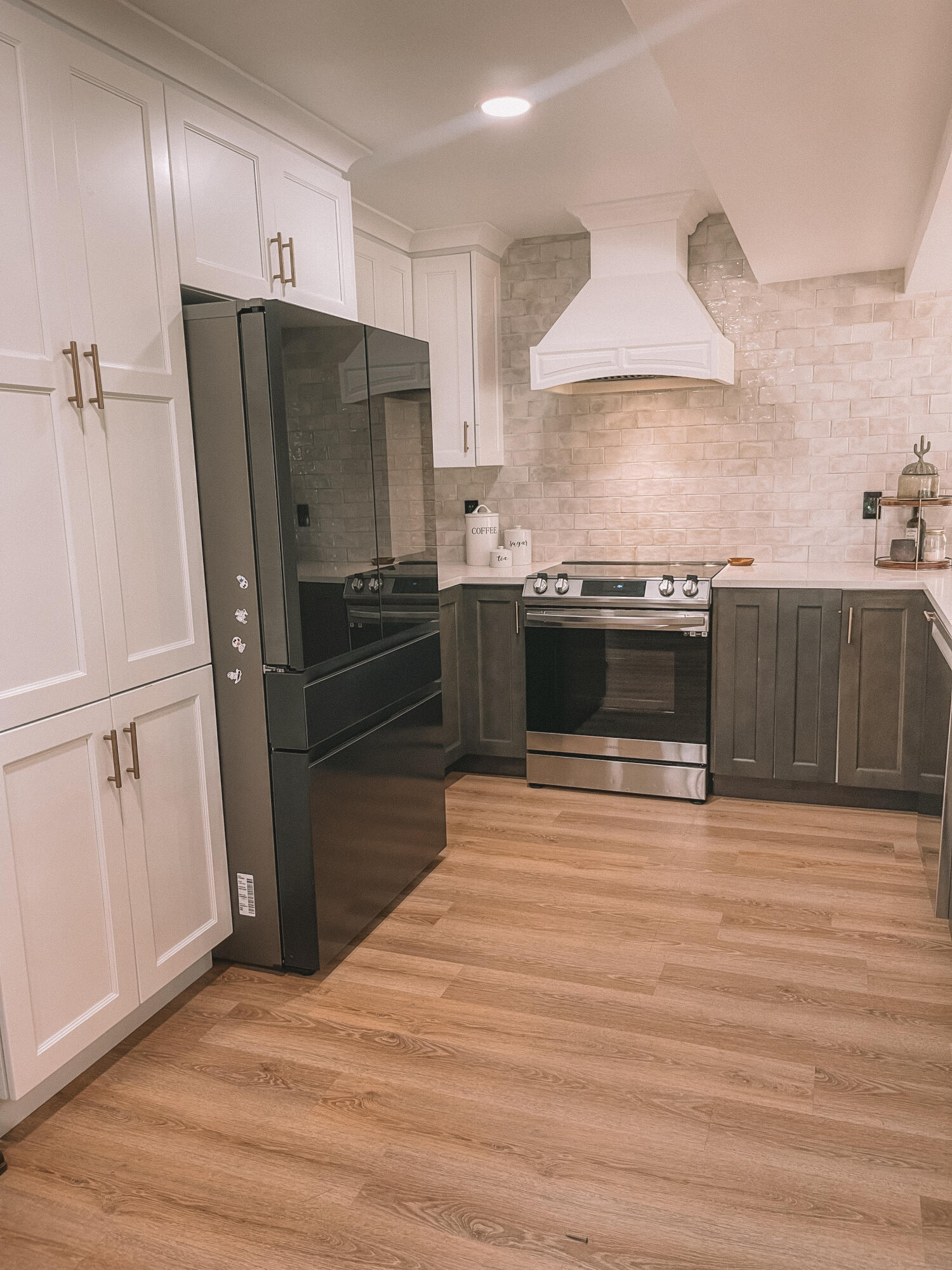 2171 Northeast 44th Court Lighthouse Point, FL 33064 - Photo 9 of 24 a kitchen with stainless steel appliances a stove a refrigerator and cabinets