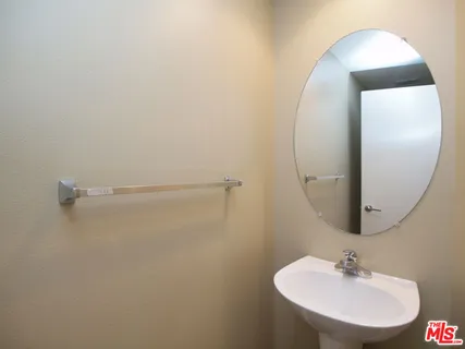 a bathroom with a sink and mirror