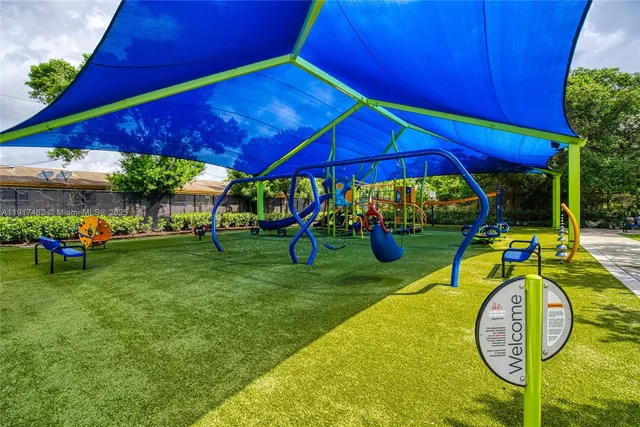 a swimming pool with outdoor seating and yard