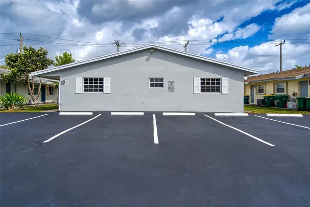 a kitchen with a sink and a refrigerator