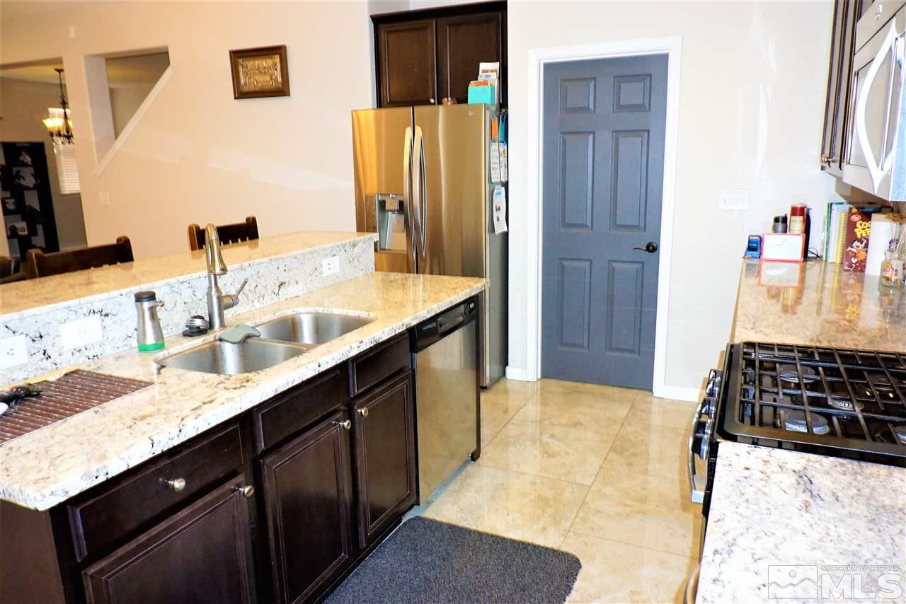 365 Terracina Way Reno, NV 89521 - Photo 6 of 25 a bathroom with a granite countertop sink and a mirror