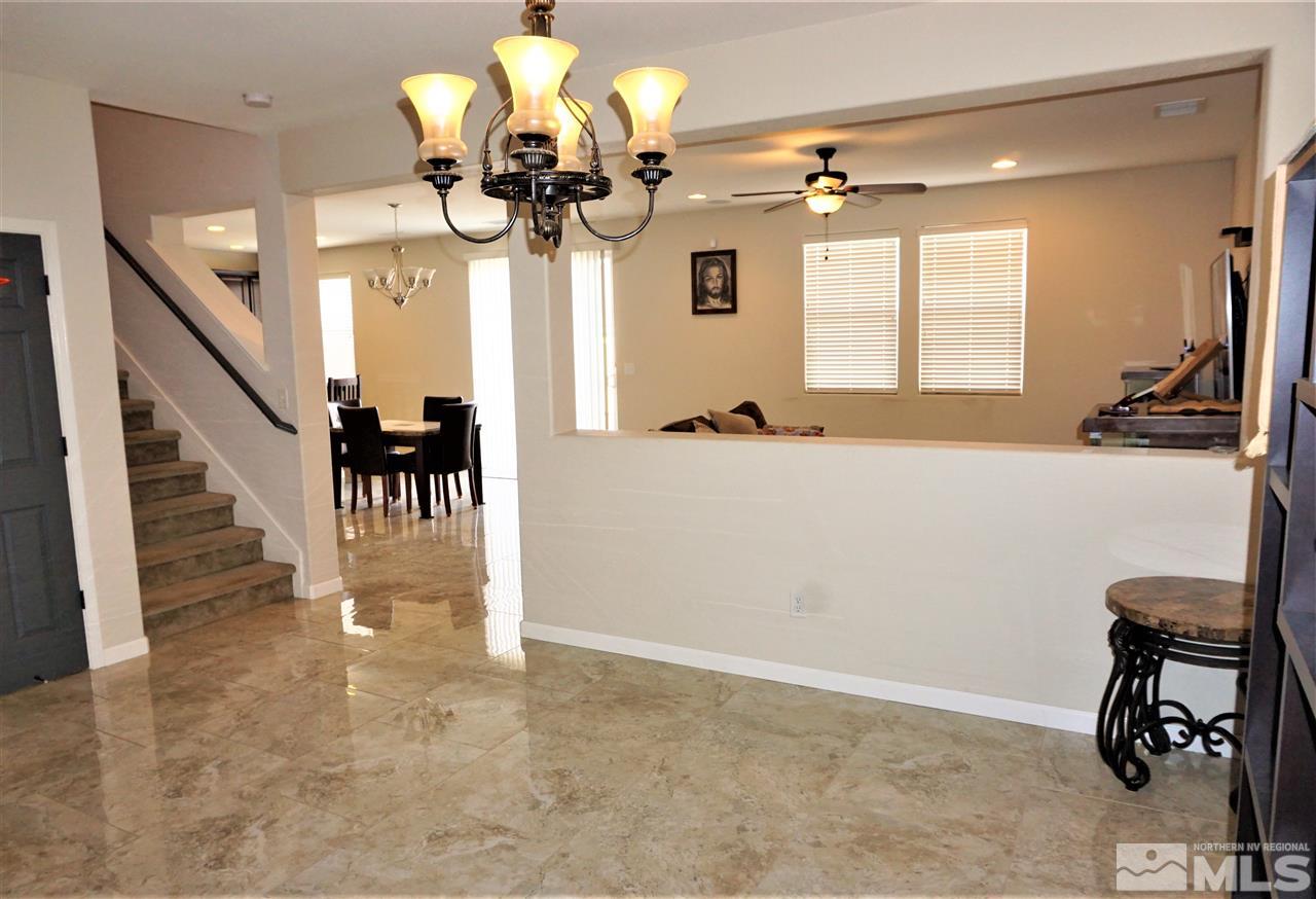 365 Terracina Way Reno, NV 89521 - Photo 8 of 25 a view of a livingroom with furniture and a chandelier