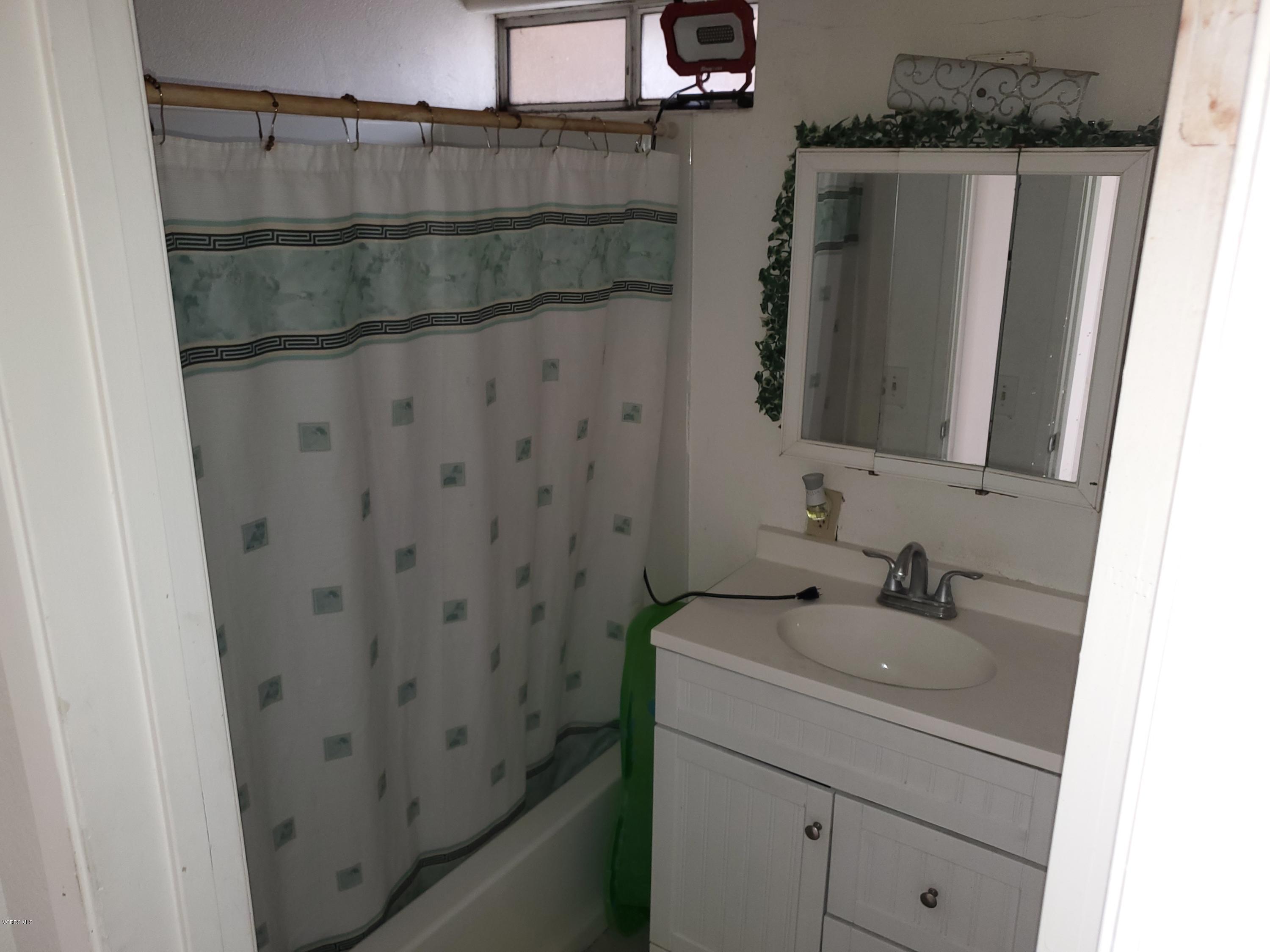 2710 Beene Road Ventura, CA 93003 - Photo 6 of 12 a bathroom with a sink and mirror