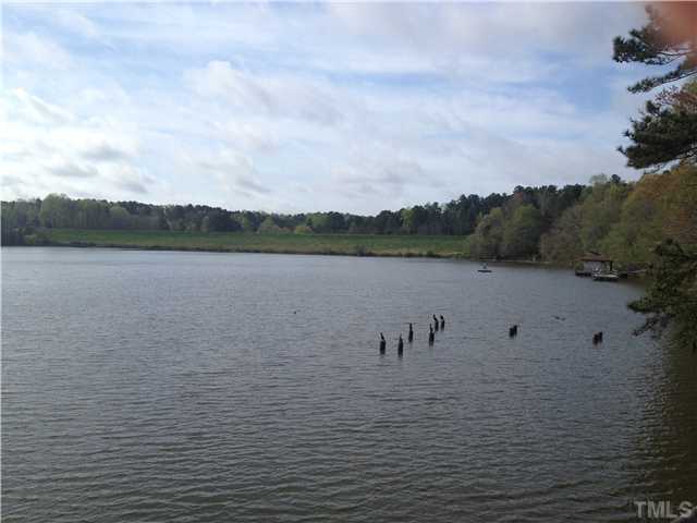 6413 Rushingbrook Drive Raleigh, NC 27612 - Photo 21 of 24 a view of a lake view