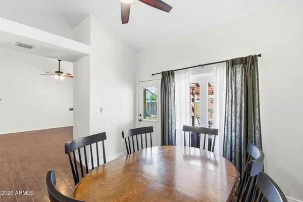 a view of a dining room with furniture window and wooden floor