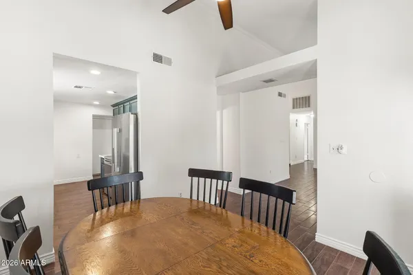 a view of a hallway with furniture and floor to ceiling window