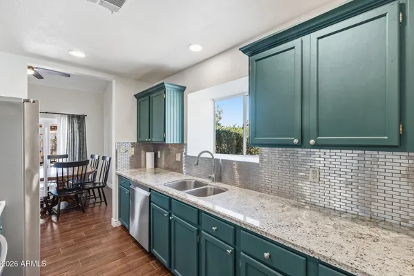 a kitchen with a sink and cabinets