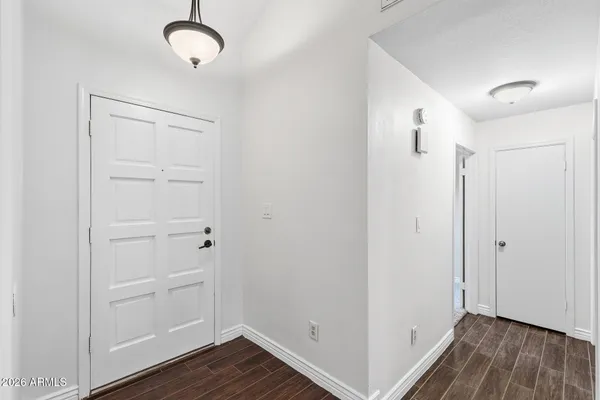 a view of room with wooden floor