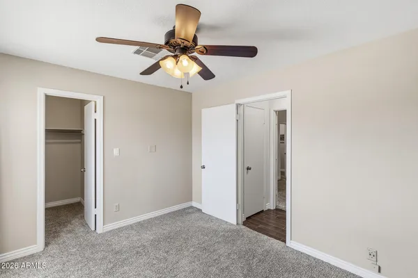 a view of a livingroom with a chandelier fan