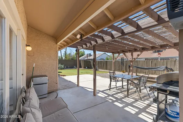 a view of a chairs and table in a patio