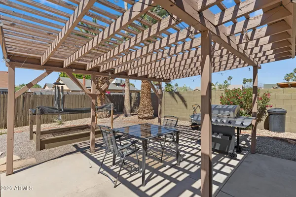 a view of a chairs and table in the patio