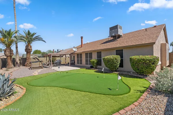 a view of a backyard with sitting area