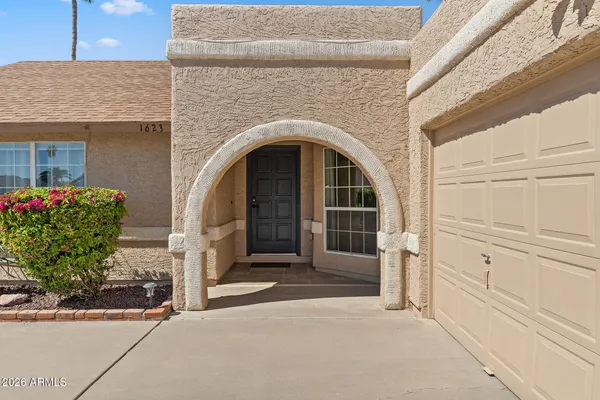a front view of a house with a garage