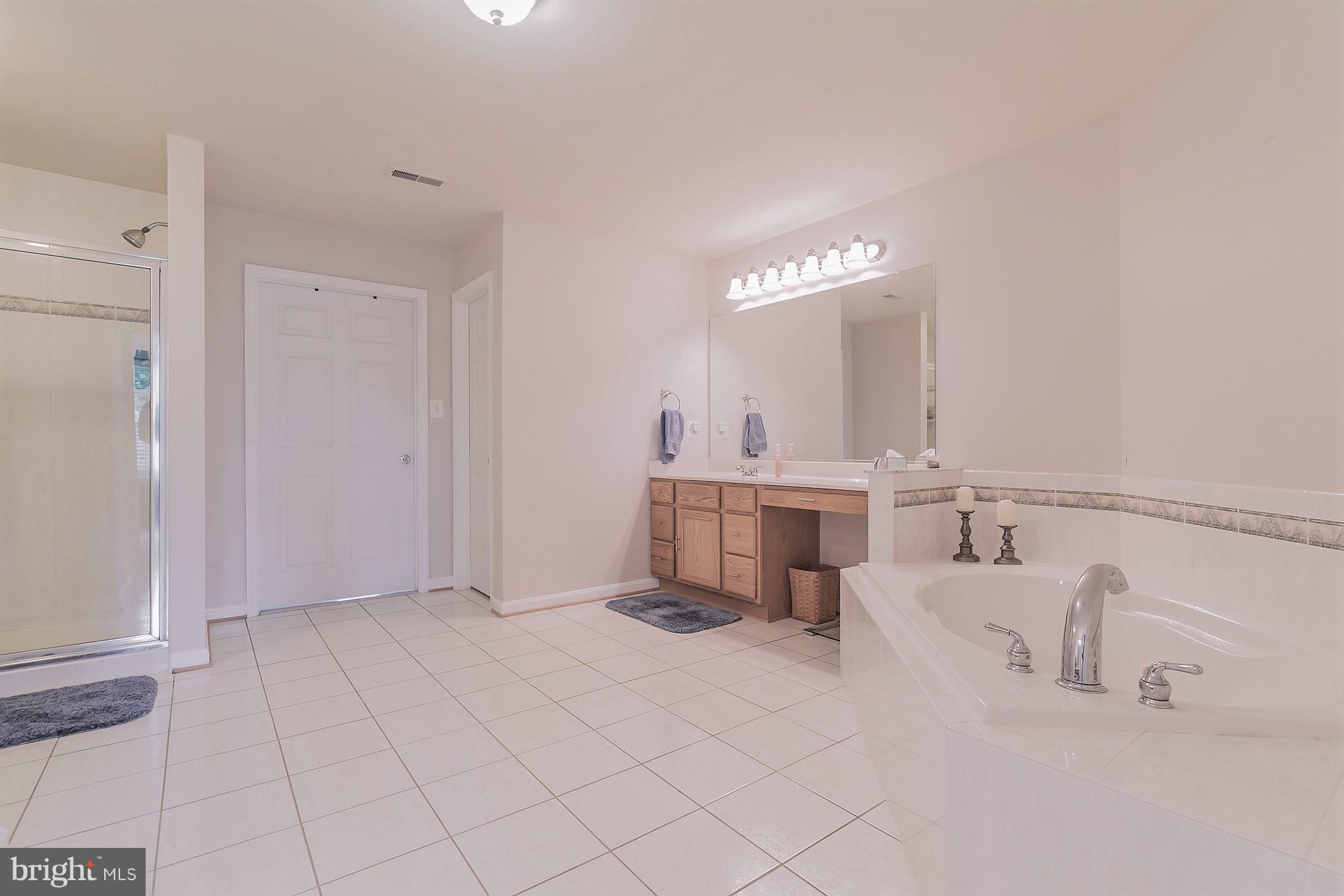 7420 Flint Hill Road Owings, MD 20736 - Photo 21 of 30 a bathroom with a sink and a mirror