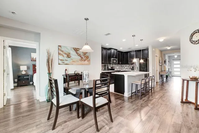 a view of a kitchen and dining room