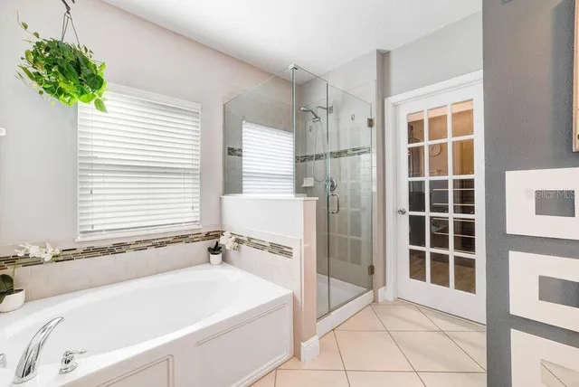 a white bath tub sitting next to a window