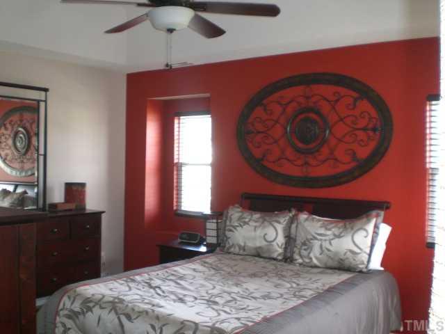 2624 Quarry Springs Road Raleigh, NC 27610 - Photo 10 of 11 a bedroom with a bed and a dresser