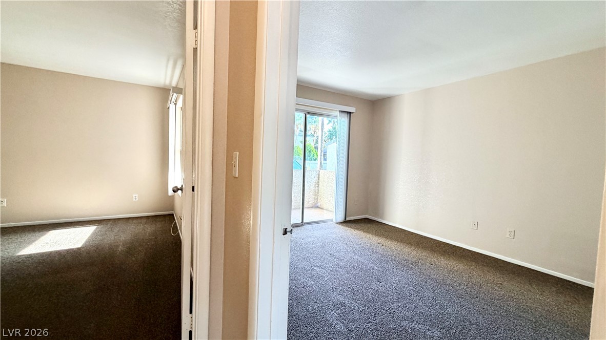 6250 West Flamingo Road, Unit 4 Las Vegas, NV 89103 - Photo 30 of 45 This airy room offers a comfortable space with direct access to an outdoor retreat.