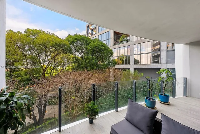 a view of a house with backyard porch and sitting area