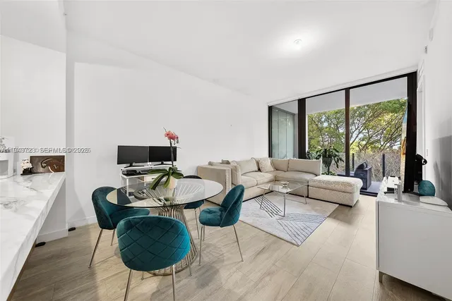 a bathroom with a sink vanity toilet and shower