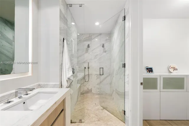 a bedroom with a large bed and a large window