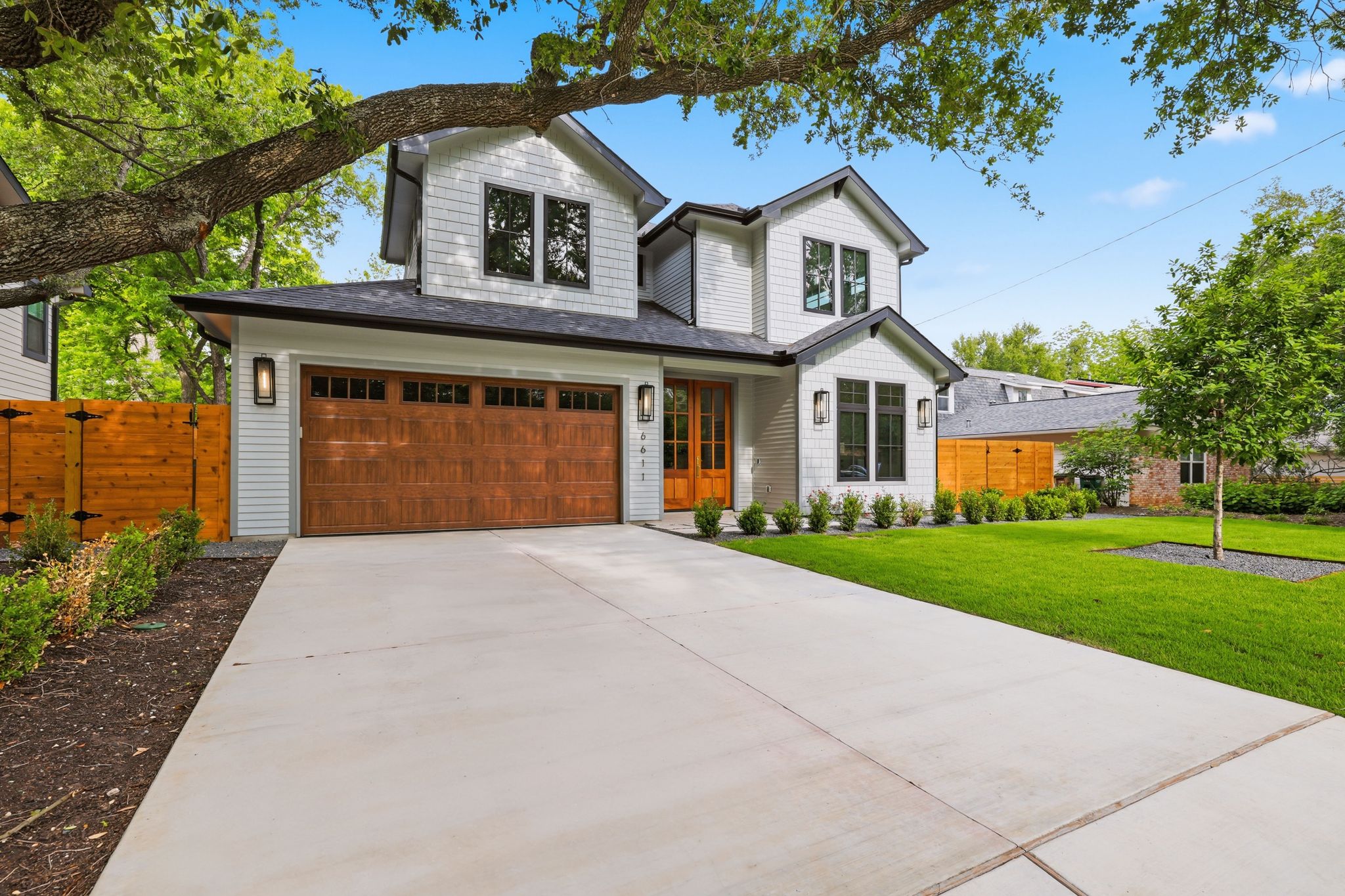 6611 Lexington Road Austin, TX 78757 - Photo 1 of 37 Contemporary exterior featuring white siding and dark trim accents