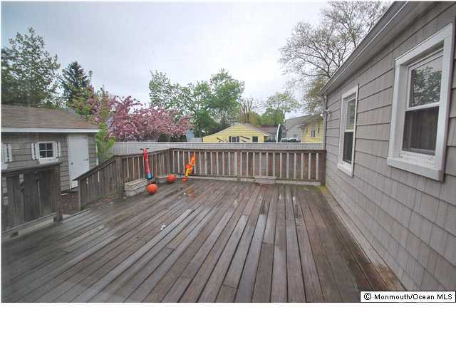 119 Ravine Drive Matawan, NJ 07747 - Photo 12 of 16 a black and white photo of a house
