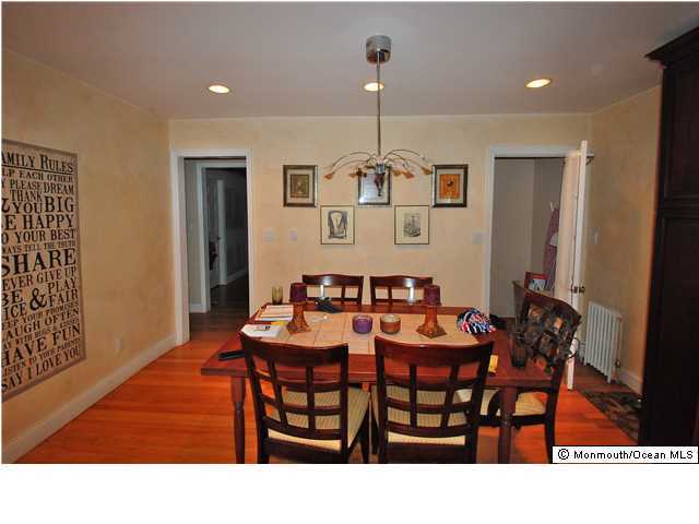 119 Ravine Drive Matawan, NJ 07747 - Photo 5 of 16 a dining room with furniture and wooden floor
