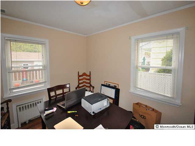 119 Ravine Drive Matawan, NJ 07747 - Photo 8 of 16 a living room with furniture and a window