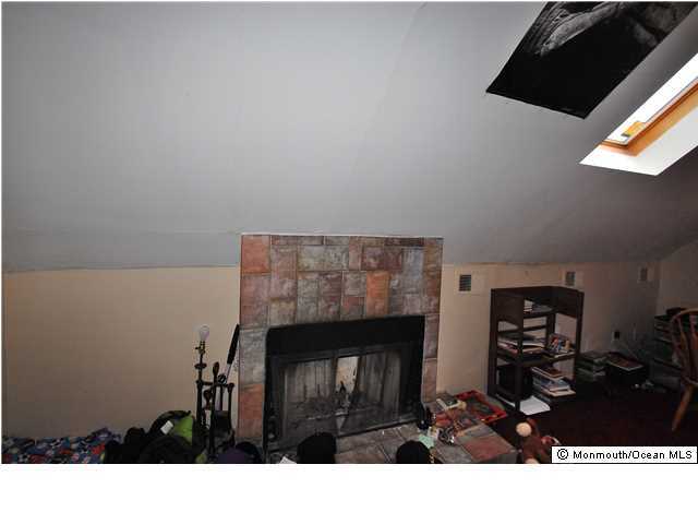 119 Ravine Drive Matawan, NJ 07747 - Photo 10 of 16 a black and white photo of a living room