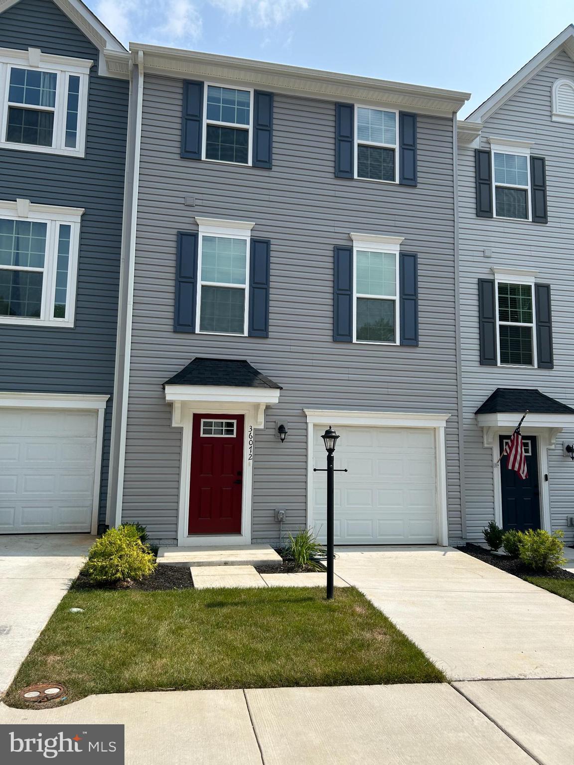 36072 Coyote Trail Locust Grove, VA 22508 - Photo 1 of 23 Charming townhouse with vibrant red door.