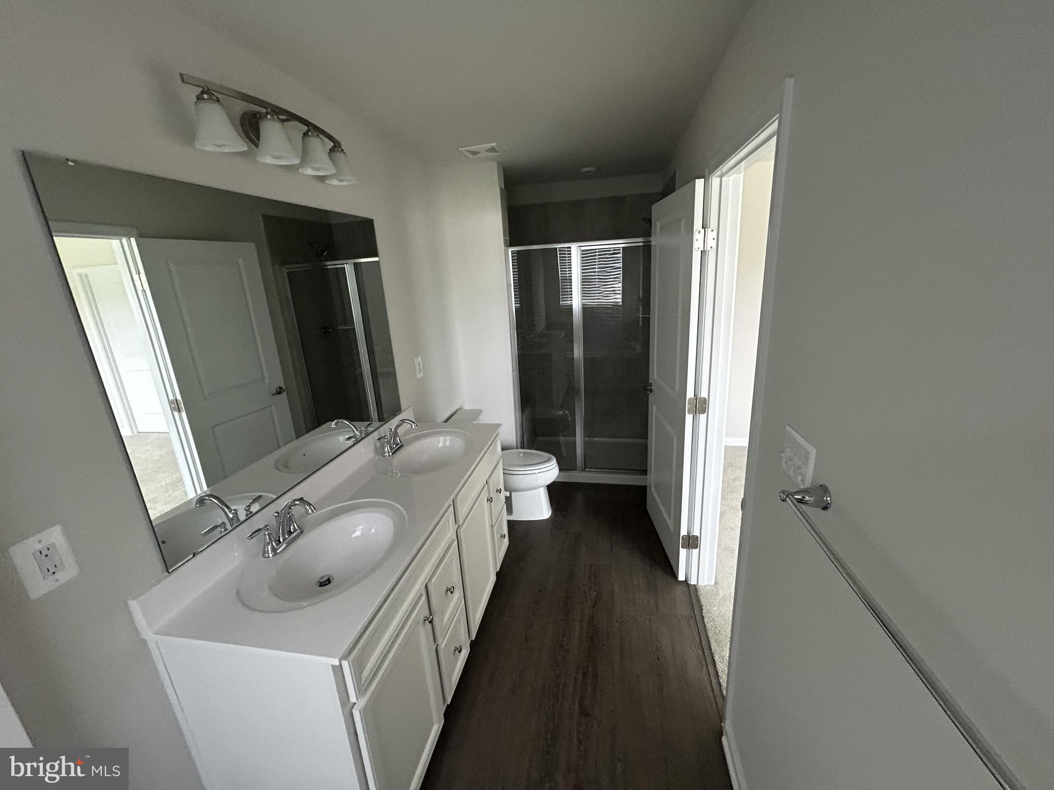 36072 Coyote Trail Locust Grove, VA 22508 - Photo 15 of 23 Sleek modern primary bathroom with dual sinks.