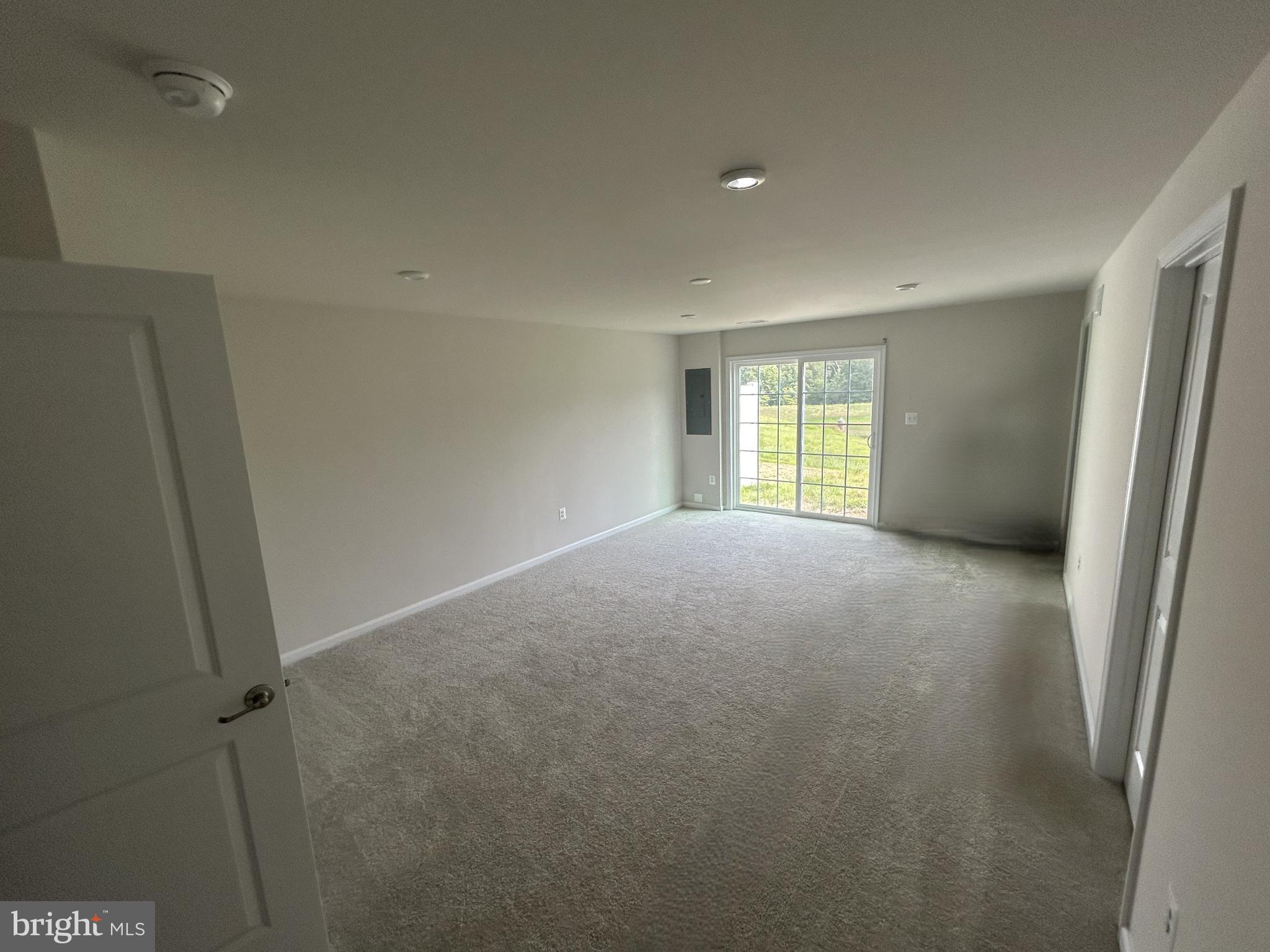 36072 Coyote Trail Locust Grove, VA 22508 - Photo 4 of 23 Spacious, light-filled room with outdoor access.