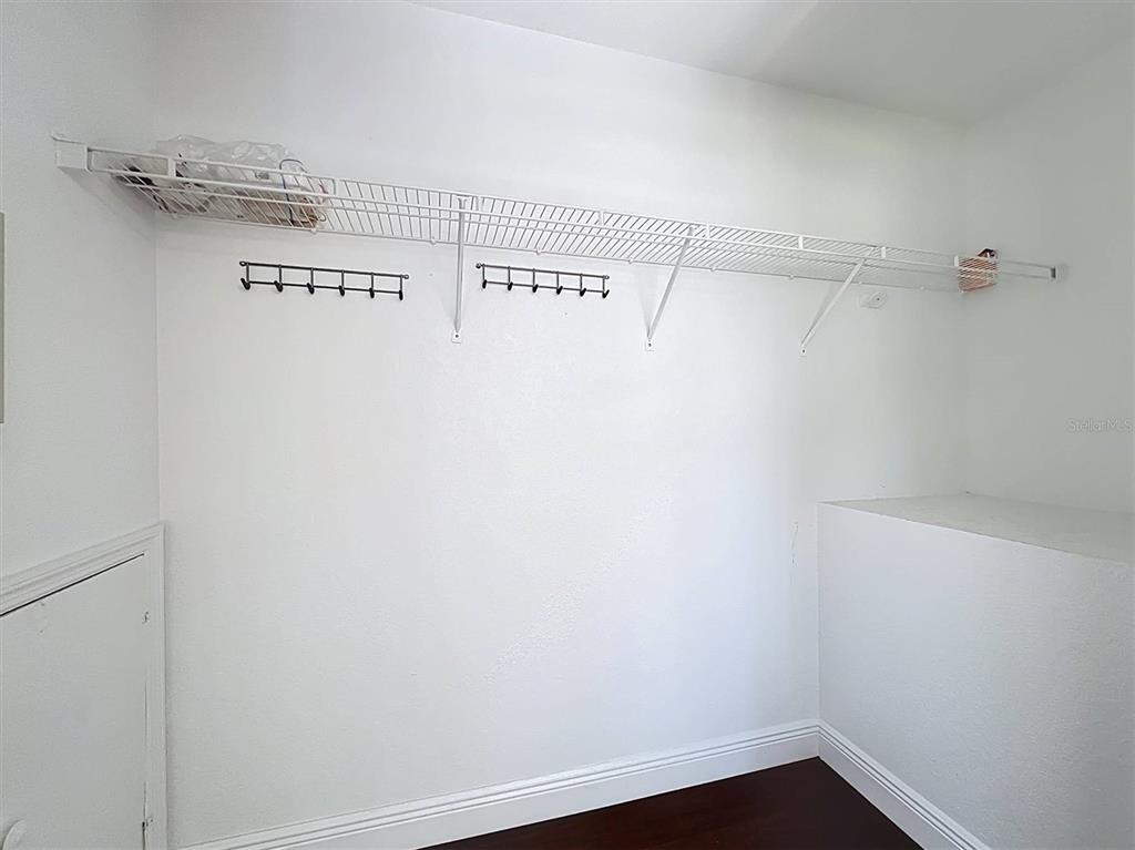 9736 Indian Key Trail, Unit 111 Seminole, FL 33776 - Photo 17 of 56 a view of a room with racks on the wall