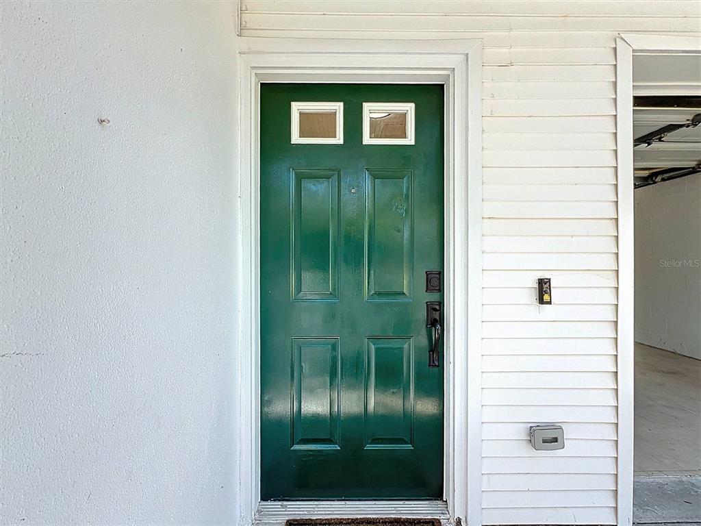 9736 Indian Key Trail, Unit 111 Seminole, FL 33776 - Photo 2 of 56 a view of a door and a window