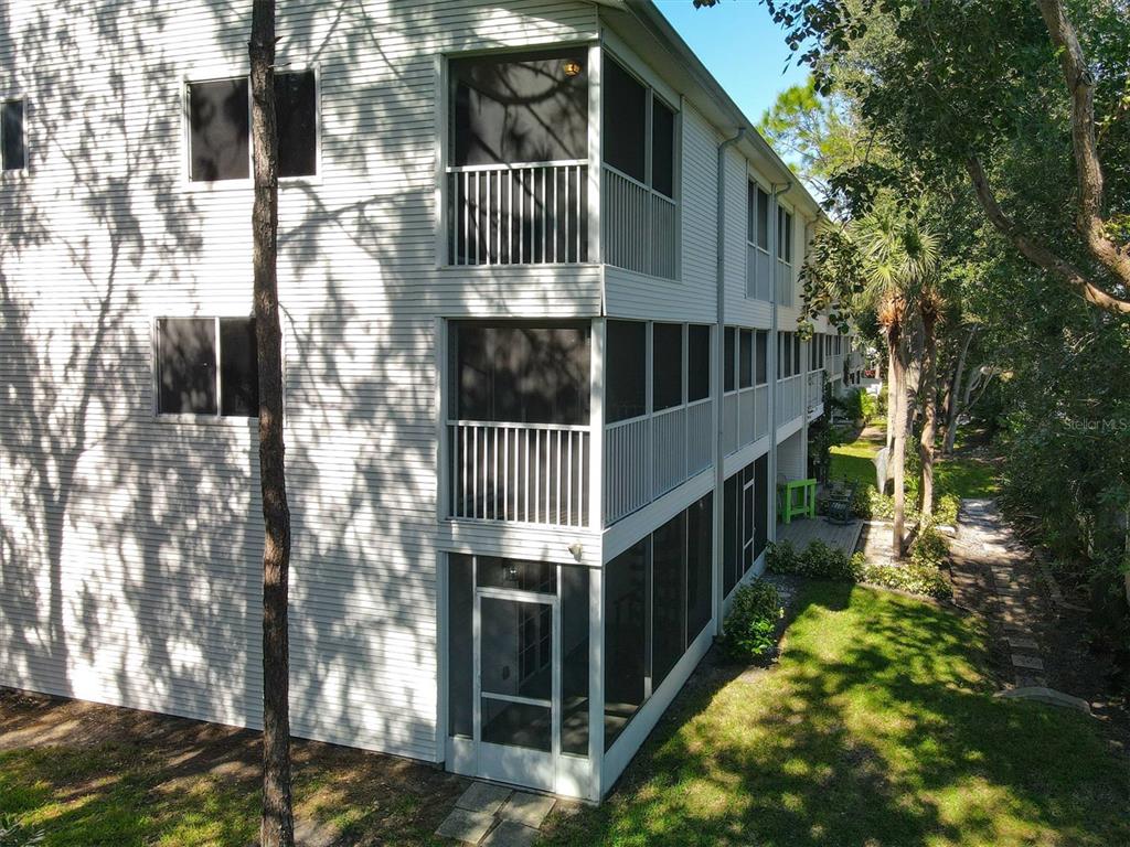 9736 Indian Key Trail, Unit 111 Seminole, FL 33776 - Photo 46 of 56 a view of balcony with small yard