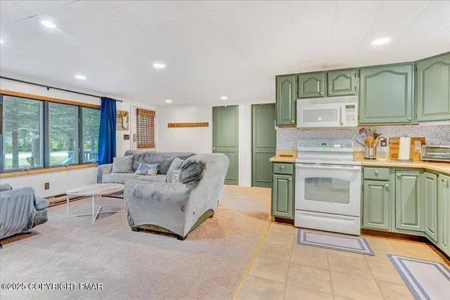 a kitchen with a refrigerator and a sink